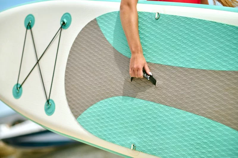 close-up-picture-person-carrying-surfing-board.jpg